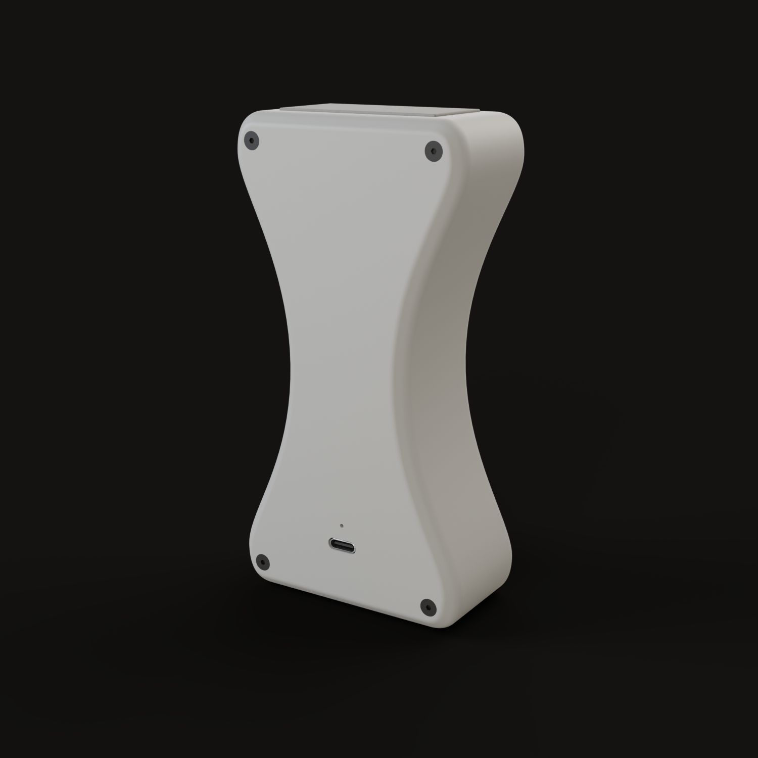 The back of Grained: a cover with four screws and a USB-C port